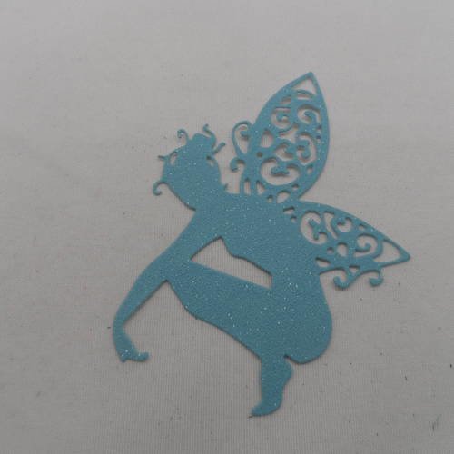 N°640 jolie fée  papillon accroupie  en papier tapisserie bleu clair à paillette  découpage fin