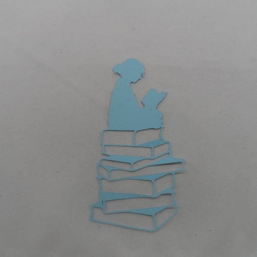 N°764  fille assise sur une pile de livres  en papier  bleu  embellissement 