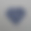 N°628 d'un  cœur rempli de petits cœurs évidés en papier bleu marine découpage fin 