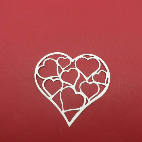 N°484 d'un cœur remplis de cœurs  en papier écru  découpage fin 
