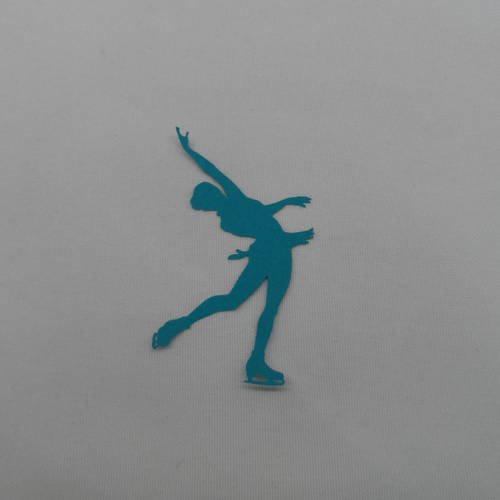 N°335 petite patineuse    en papier bleu turquoise  découpage  fin 