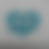 N°113    d'un cœur entrelacé avec des alliances en papier  bleu turquoise  découpage fin 