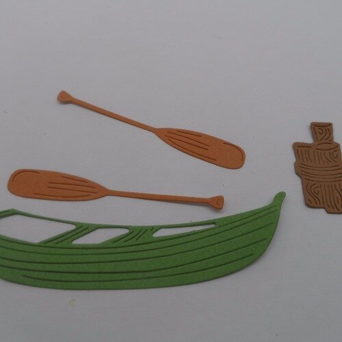 N°874  d'une barque avec 2 rames  et un piquet  en papier vert, marron   découpage fin