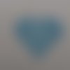 N°628 d'un  cœur rempli de petits cœurs évidés en papier bleu n°1 découpage fin 