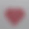 N°628 d'un  cœur rempli de petits cœurs évidés en papier rouge découpage fin 