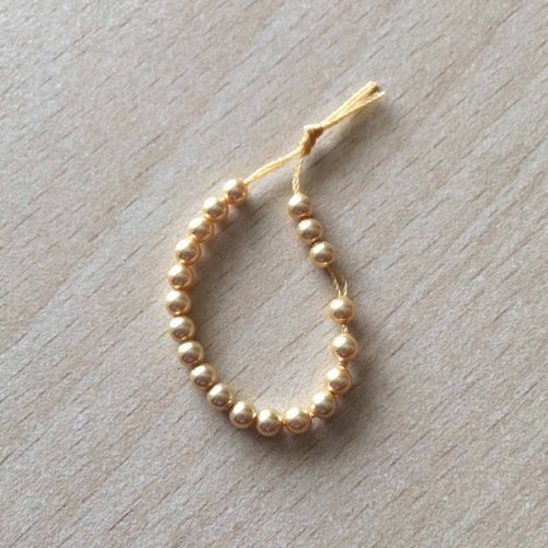 Sachet de perles de swarovski  couleur gold