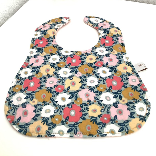 Bavoir bébé à fleurs moutardes et roses