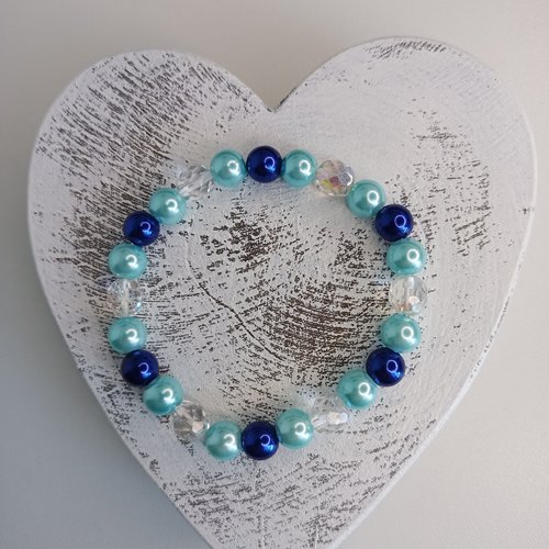 Bracelet élastique en perles, coloris bleu et transparent. taille 17cm