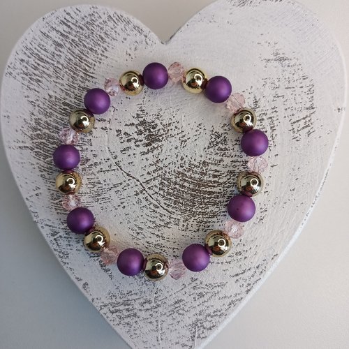 Bracelet élastique en perles, coloris violet et doré. taille 16cm.
