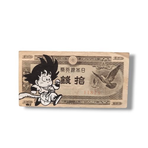 Création originale money art - son goku enfant sur véritable billet de banque japonais