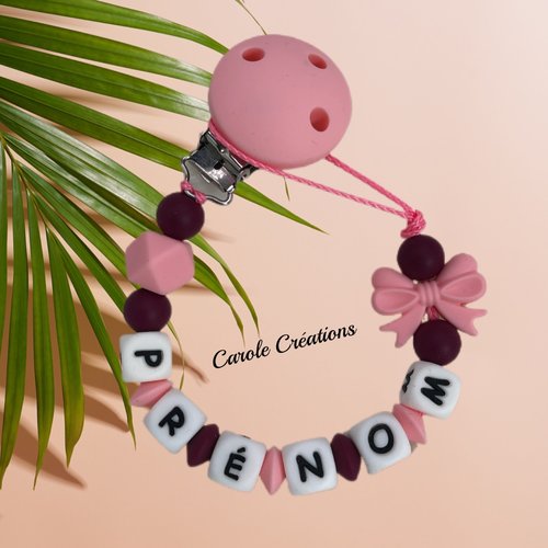 Attache tétine personnalisé en silicone, modèle fille nœud coloris rose pastel et rouge vin bordeaux