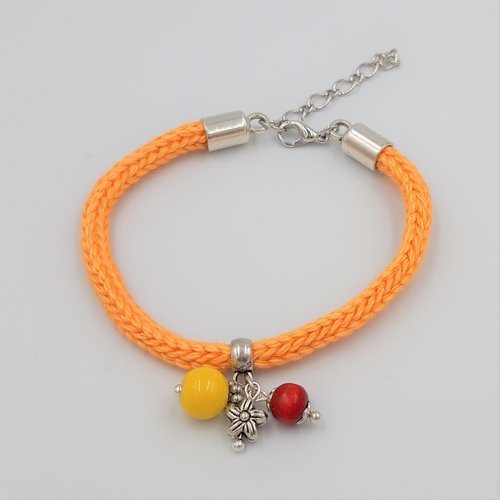 Vendu - bracelet orange pastel au tricot