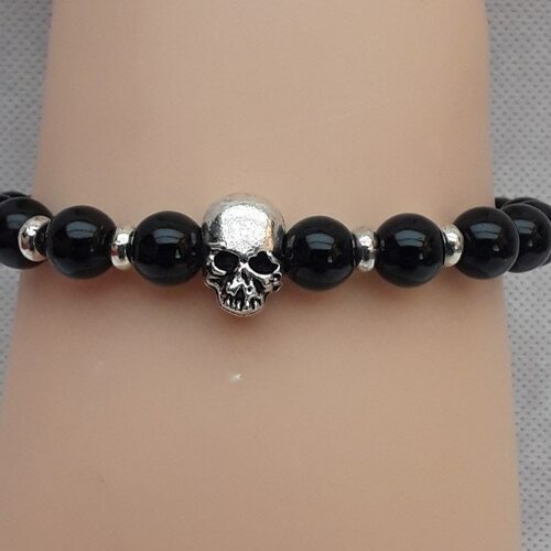 Bracelet , extensible , ajustable , perles  noires , tête de mort , crâne , skulls