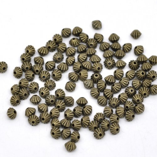 34 perles métal toupie 5 mm bronze