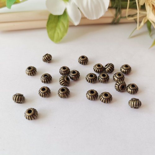 44 perles métal toupie 5 mm bronze