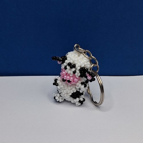 Porte-clés vache blanche et noir en perles