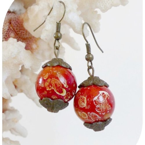 Boucles d'oreilles perles rousses en acrylique .