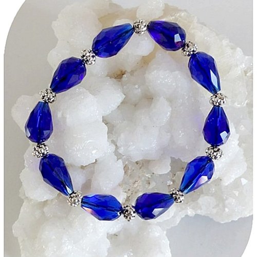 Bracelet élastique perles de verre bleues facettées et perles métal argenté.