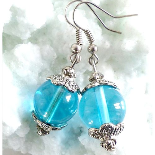 Boucles d'oreilles grosses perles bleues .