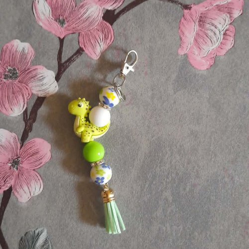 Porte clé en perles silicone avec petit dinosaure
