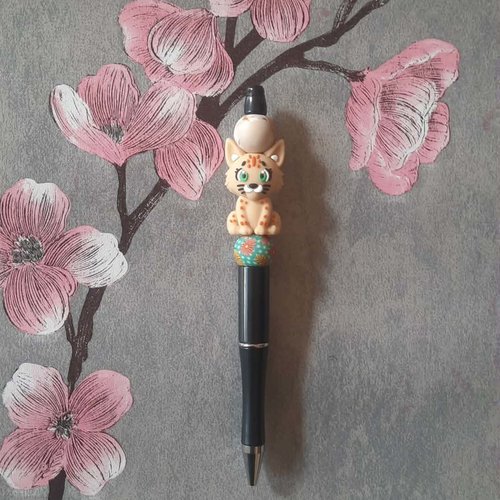 Stylo rétractable encre noire avec perles et petit lion