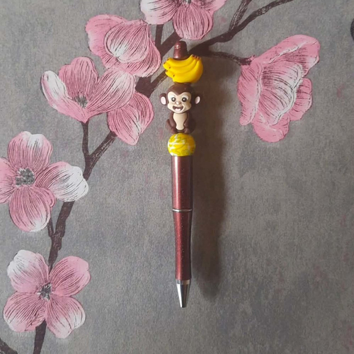 Stylo rétractable encre noire avec perles et singe