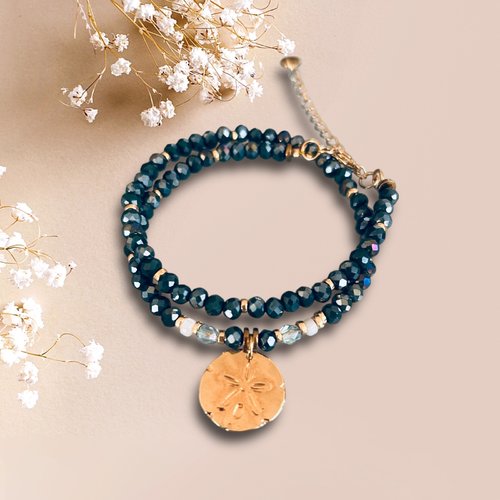 Bracelet double perles hématites bleues et médaille dollar des sables plaqué or