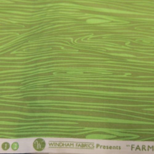 Coupon de tissu coton fond vert motif tronc d'arbres 