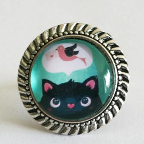 Bague cabochon en verre "rêve de chat" rose et turquoise sur monture ronde en métal argent vieilli 