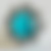 Bague ronde style victorien cabochon en pierre oeil de chat bleu turquoise  sur monture florale en laiton couleur 