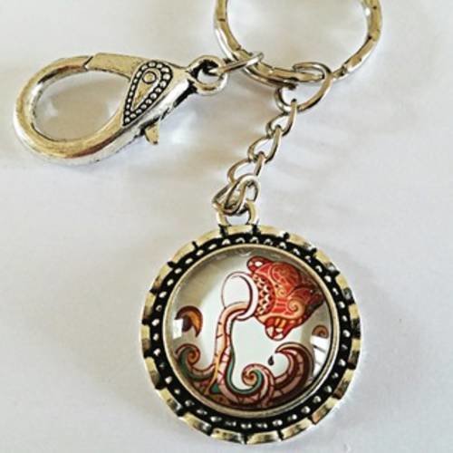 Bijou de sac/porte clés signe du zodiaque "verseau" avec cabochon en verre, mousqueton ciselé et anneau 