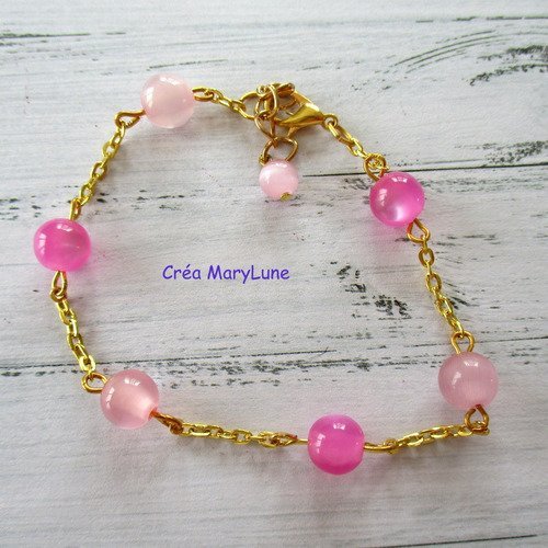 Bracelet en perles oeil de chat de couleur rose et fuchsia - 2137256