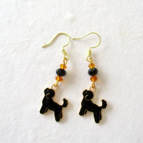 Boucles d'oreilles perle orange et noire et breloque chien