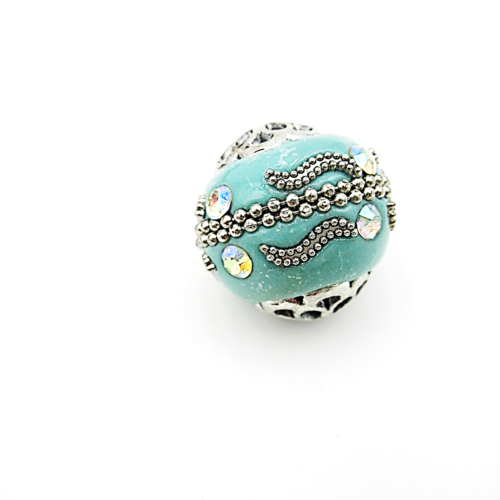 Perle indonésienne, faite main, sur fond turquoise avec strass