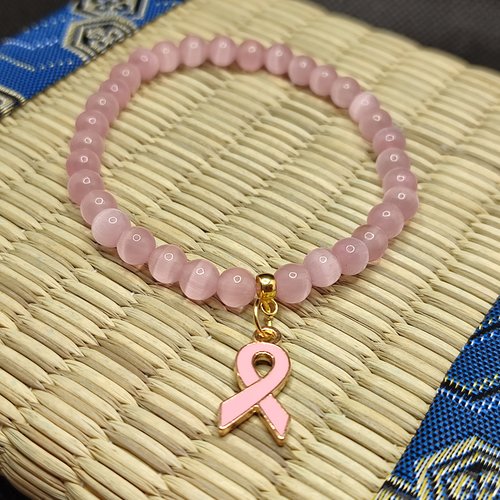 Bracelet octobre rose, bracelet oeil de chat, modèle sans inserts, perles 6 millimètres qualité aaa, logo clair