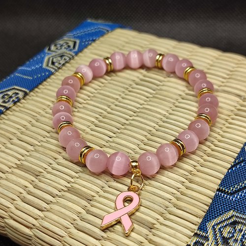 Bracelet octobre rose, bracelet oeil de chat, modèle avec inserts, perles 8 millimètres qualité aaa, logo clair