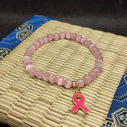 Bracelet octobre rose, bracelet oeil de chat, modèle sans inserts, perles 6 millimètres qualité aaa, logo foncé