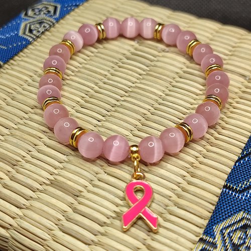 Bracelet octobre rose, bracelet oeil de chat, modèle avec inserts, perles 8 millimètres qualité aaa, logo foncé