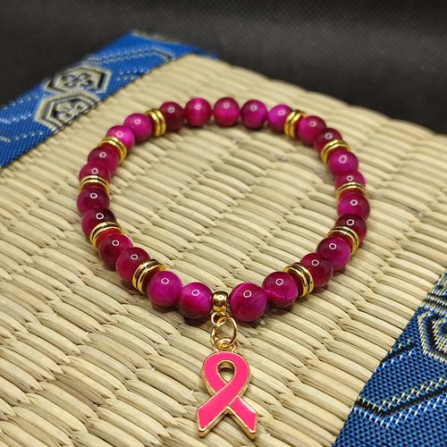Bracelet octobre rose, bracelet oeil de tigre rose, modèle avec inserts, perles 6 millimètres qualité aaaaa, logo foncé
