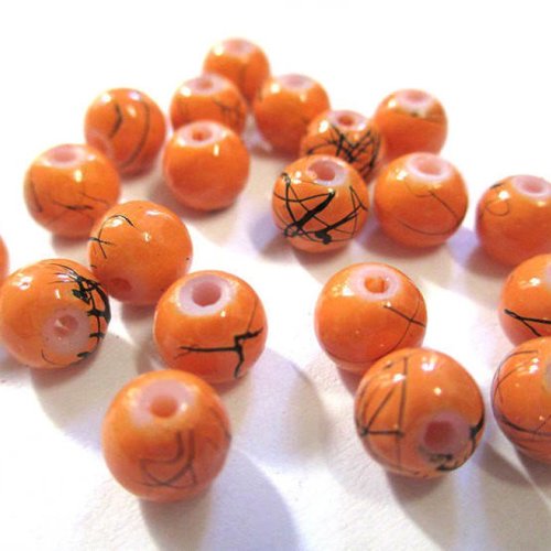20 perles en verre orange tréfilées noir 6mm