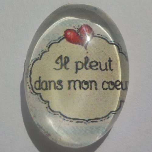 Cabochon d'écriture il pleut dans mon coeur, ovale, 18x25 mm, verre, noir, beige