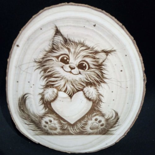 Gravure d'un chaton avec un coeur