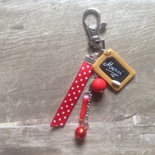 Porte clef bijou de sac "merci" cadeau maîtresse ruban rouge et grelot  rouge 