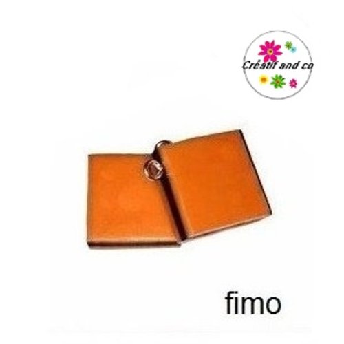 Breloque bonbon anglais orange/noir en fimo