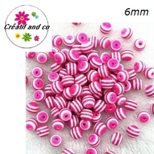 X10 perles rondes résine rayées fuchsias/blanches 6mm
