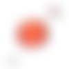 Bouton pression rouge orangé à pois blanc