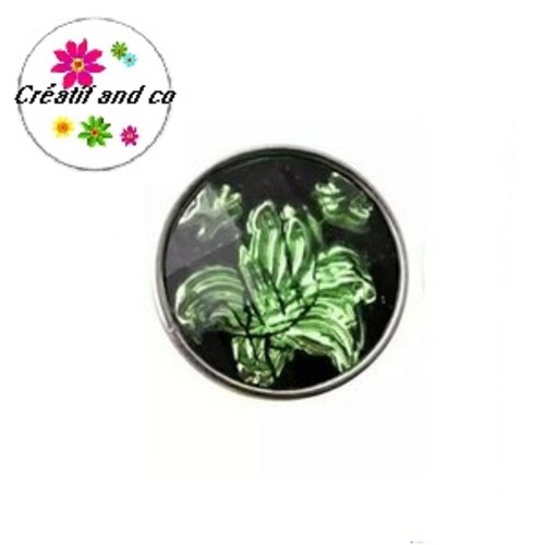 Bouton pression fond noir motif vert résine