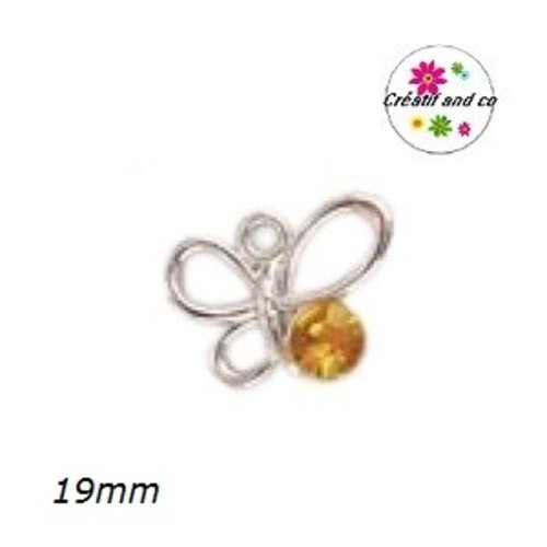 Breloque papillon acrylique et strass ambre