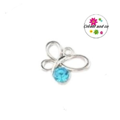 Papillon acrylique et strass turquoise
