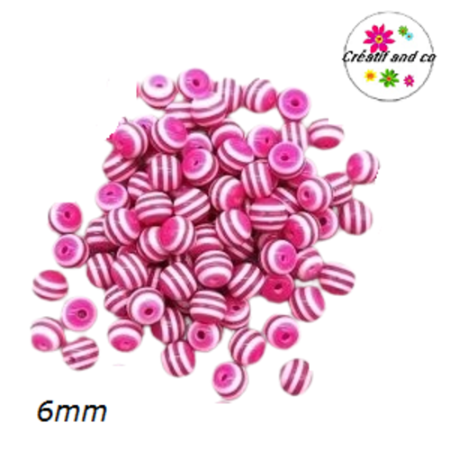 X10 perles rondes résine rayées fuchsias/blanches 6mm